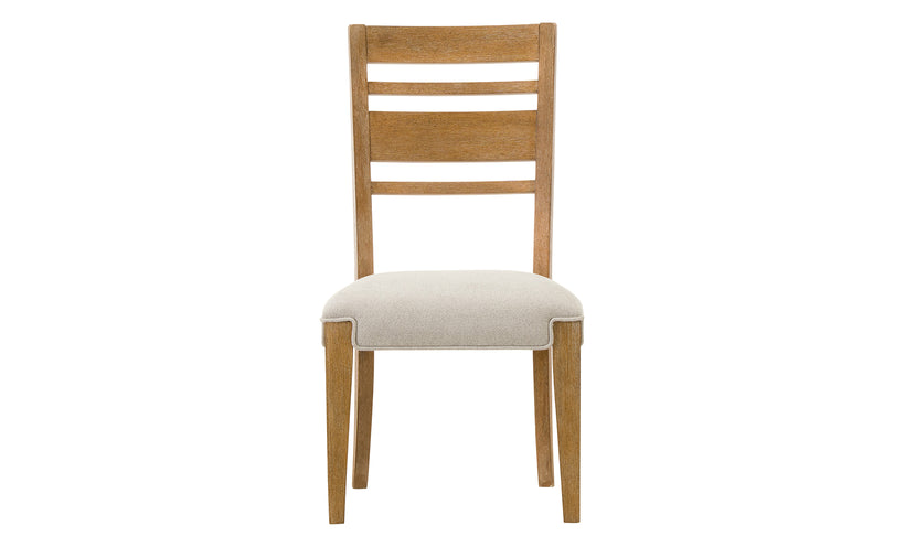 Wooden chair with a white cushion on a white background